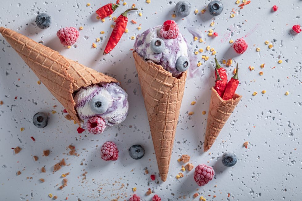 Fresh ice cream with berries and chilli. Strange icecream.