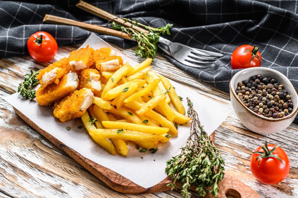 Fried Fish Sticks with French Fries. British fish and chips, fried potato